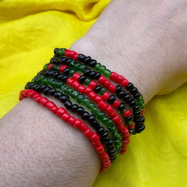 Pan African glass seed bead stretch bracelets. Stackable handmade beaded bracelet. Pan African Flag bracelet set. Red black & green bracelet