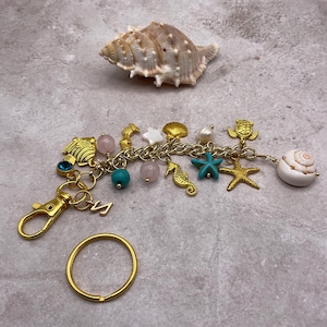 Sea life golden keychain. Beach purse charm. Summer time gift. Handmade pool key ring. White shell clip on backpack charm. Marine life charm