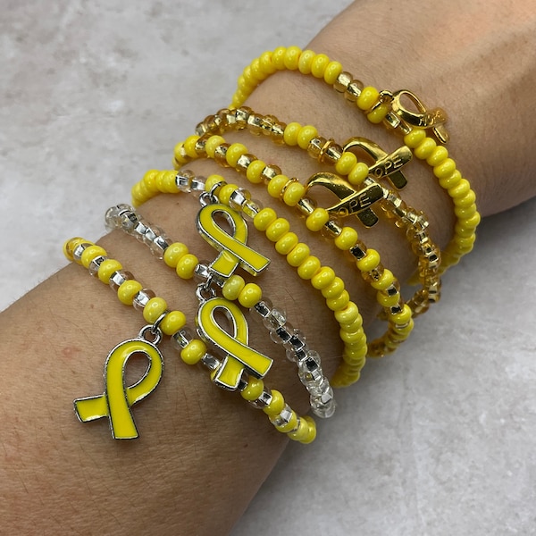 Childhood Cancer awareness glass seed bead stretch bracelet. Hope ribbon bracelet. Endometriosis awareness Yellow ribbon charm bracelet gift