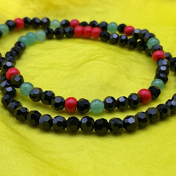 Pan African Faceted bead glass bead stretch bracelets. Stackable bracelets. Beaded handmade bracelets. MLK bracelet. BLM bracelet