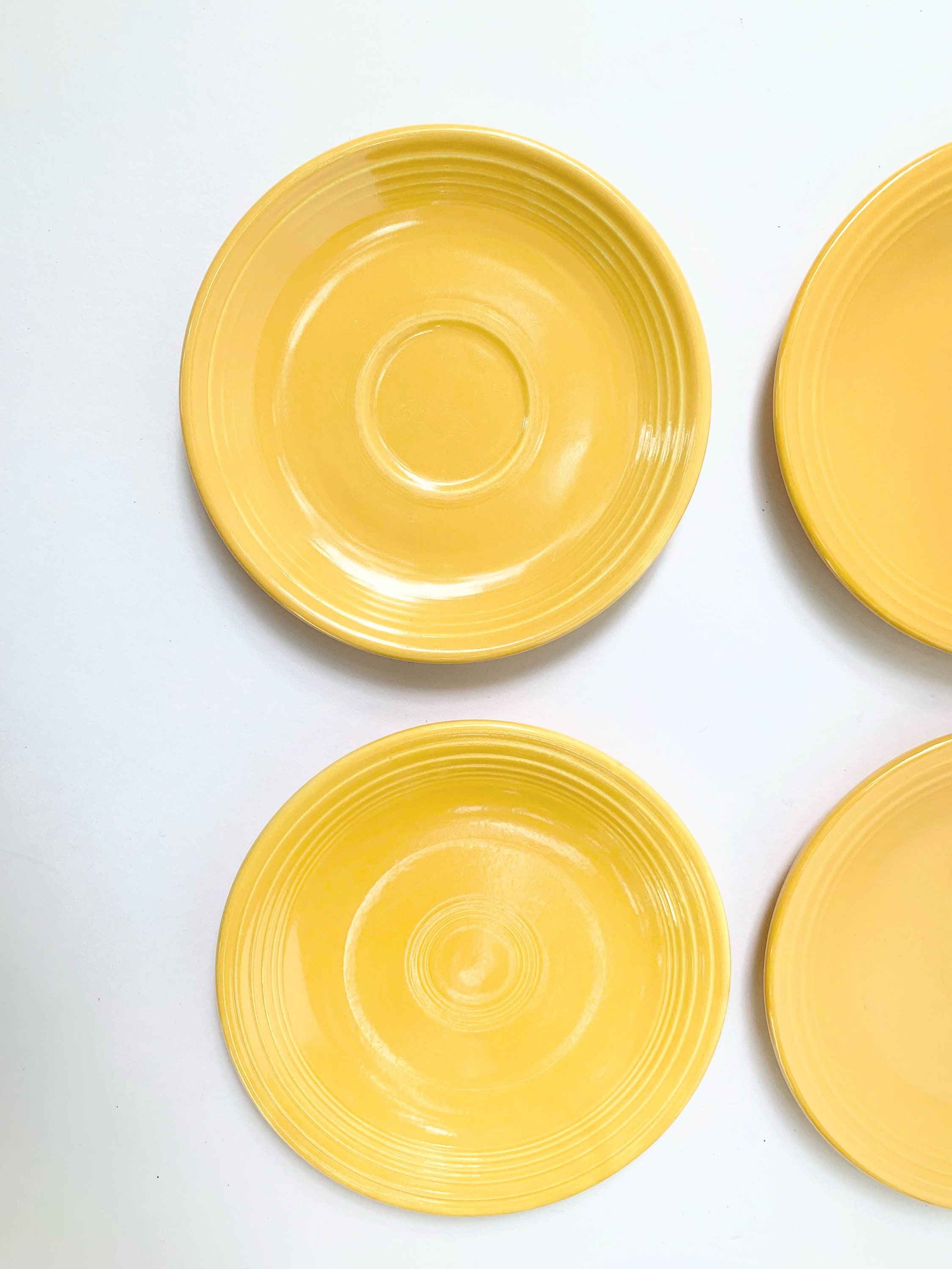 Lot of 4 marigold yellow saucers 2 Fiestaware 2 knockoffs Etsy