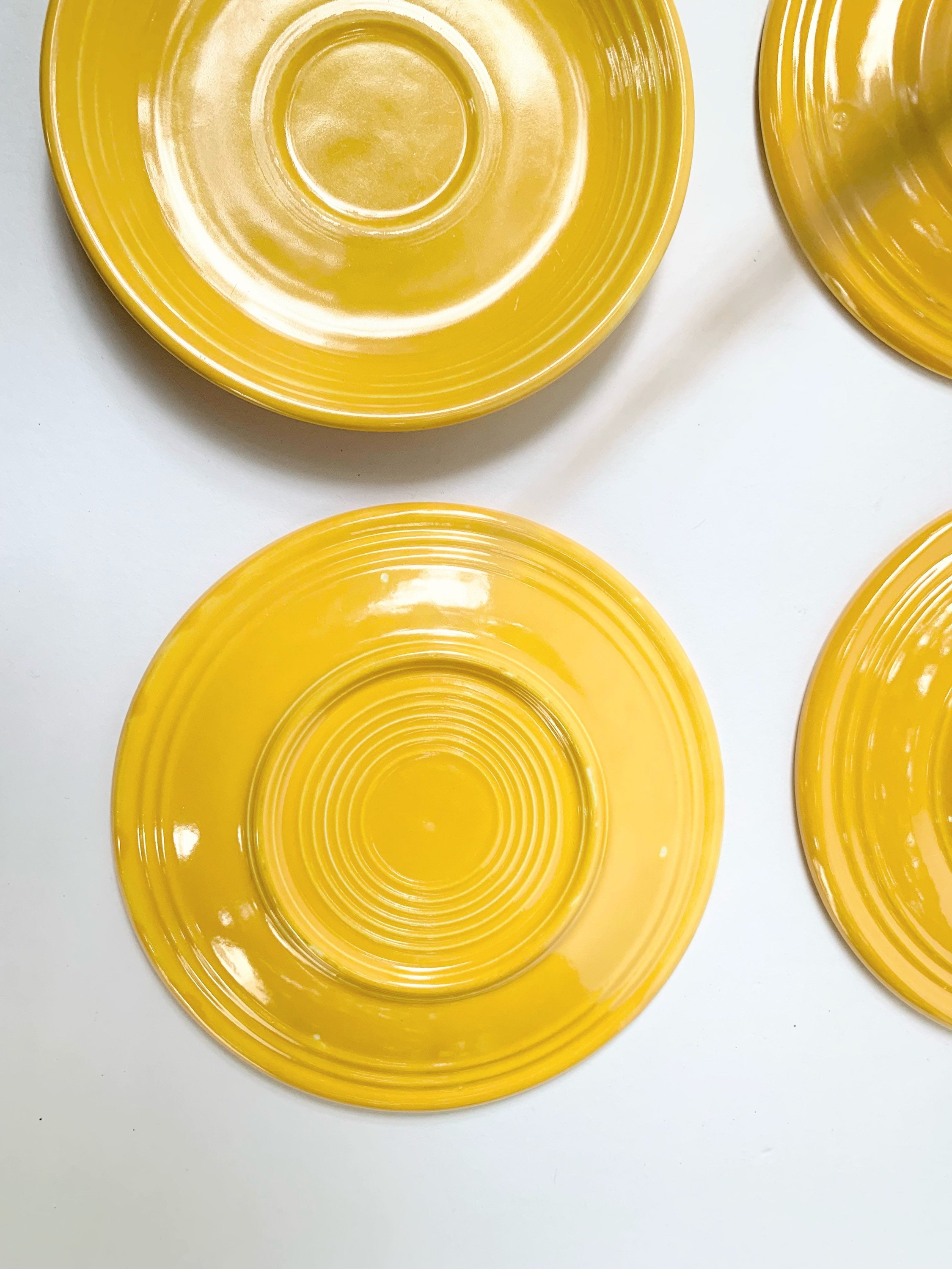 Lot of 4 marigold yellow saucers 2 Fiestaware 2 knockoffs Etsy