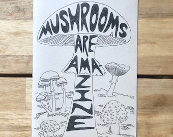 May include: A black and white illustration of a mushroom with the text "Mushrooms Are Amazing Zine" on it. The illustration is surrounded by smaller mushrooms.
