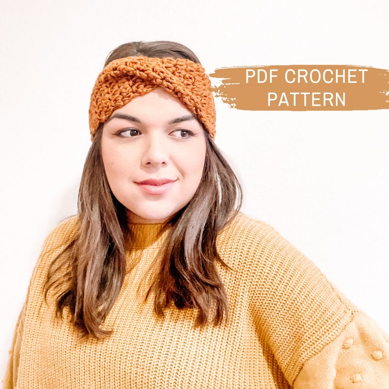 May include: A crocheted headband in a warm brown color. The headband is twisted and has a simple, elegant design. PDF CROCHET PATTERN text is visible in the image.