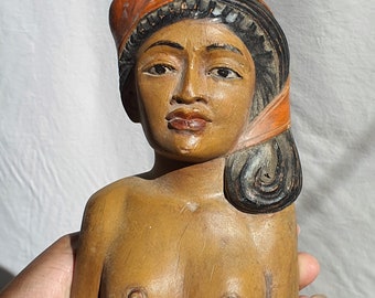 Old Balinese village lady with scarf hat