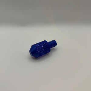 May include: A blue plastic intake filter featuring a cylindrical mesh body with a grid pattern, a solid conical tip, and a ribbed hose connector at the opposite end. The component is designed for fluid filtration and hose attachment applications.