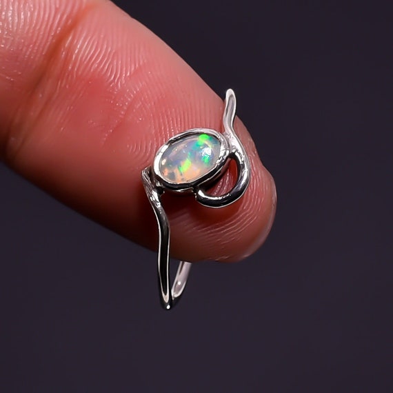 Ethiopian Opal Sterling Silver Ring: Faceted Oval Gemstone