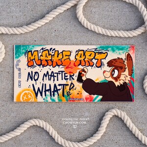 May include: A sticker featuring a cartoon animal holding a spray can with the text "Make Art No Matter What" in a graffiti style. The sticker has a colorful background with a bright orange, yellow, and blue color scheme.