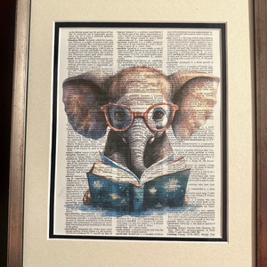 May include: A watercolor illustration of an elephant wearing glasses and reading a book. The image is superimposed on a vintage dictionary page with the word "Canary" highlighted.