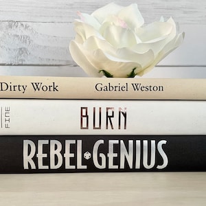 Black Beige and White Decorative Book Stack