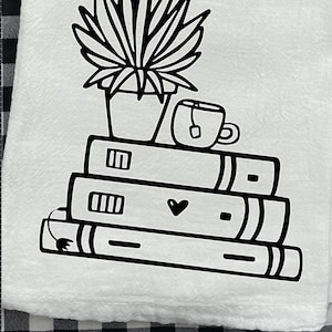 May include: Black and white illustration of a stack of books with a potted plant and a cup of tea on top. The books have a heart drawn on the front.