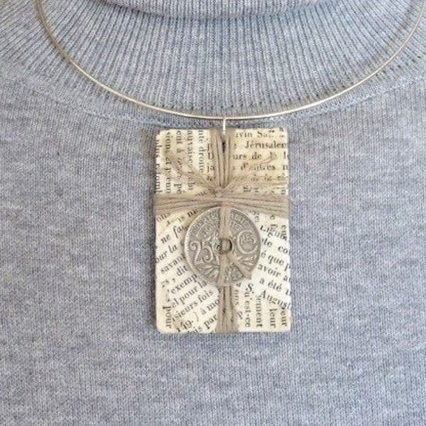 Zero waste jewelry. Upcycling jewel. Bible pages pendant, old French coin, string. Recycled materials. Recycled jewel. Recycling.