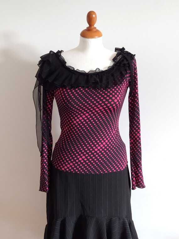 Black with pink dots stretchy top with ruffled nec