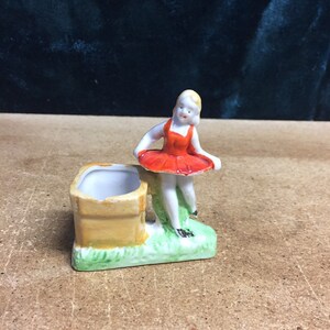 Made in Japan ceramic girl standing by well
