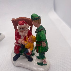 Christmas village figures lemax Santa Claus , man carrying wood and dad son running errands