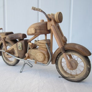 Single-cylinder wooden motorcycle.