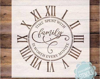 May include: A white stencil with a clock face design. The clock face has Roman numerals and the text "Time spent with family is worth every minute".