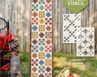Puede incluir: Un letrero de madera rectangular alto que presenta un patrón de edredón vertical con estrellas multicolores en tonos óxido, azul, amarillo y rosa. Se muestran dos plantillas rectangulares blancas con recortes de estrellas.
