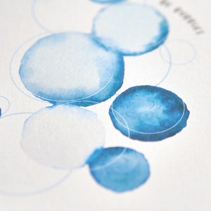 May include: Watercolor art print featuring blue circles of varying sizes and shades, connected by thin, light blue lines. The design is on a white background, with a few words in the upper right corner.