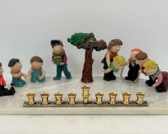 Artistic Menorah on Marble Base with Children Playing