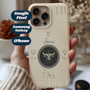 May include: A cream-coloured phone case with a Taurus zodiac design, featuring a bull illustration and the word "Taurus". The case also displays astrological symbols. Options for Google Pixel, Samsung Galaxy, and iPhone are shown.