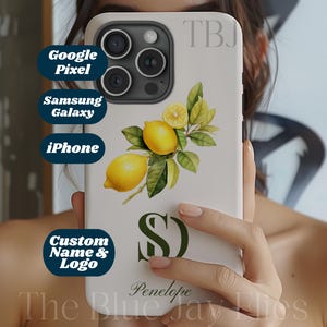 May include: Cream-coloured phone case featuring a lemon and leaf illustration, the letter "S", and the name "Penelope". The case is shown with the text "Google Pixel", "Samsung Galaxy", "iPhone", and "Custom Name & Logo". The text "The Blue Jay Flies" is also visible.