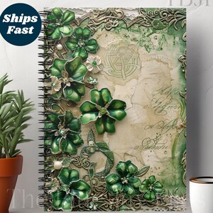 May include: A spiral bound notebook with a green and gold cover featuring a floral design with intricate details. The cover has a vintage aesthetic with a distressed background and handwritten text.