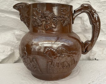 Antique Brown Salt-Glazed Stoneware Jug with Green Man Spout and Hound Dog Handle