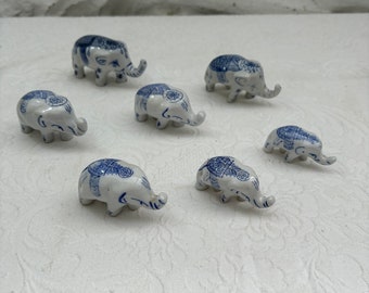 Vintage Set of Seven Miniature Blue and White Ceramic Elephants