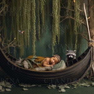 May include: A newborn baby is sleeping in a wooden boat, surrounded by greenery. A raccoon is peeking out from the boat. The scene is set in a forest with a green background and a small bird flying overhead.