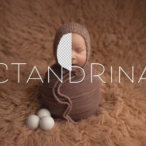 May include: A newborn baby wrapped in a brown swaddle, wearing a brown knitted hat, sleeping on a brown fuzzy surface. The baby's face is partially obscured by the hat. The text "CTANDRINA" is visible in the image.