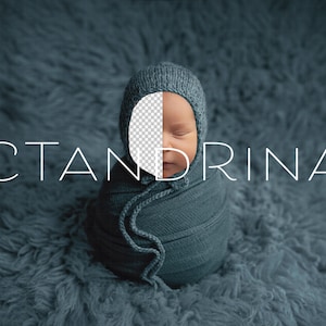 May include: A baby wrapped in a blue knitted blanket with a matching knitted hat. The baby's face is partially visible, with eyes closed. The text "CTANDRINA" is written in white letters across the image.
