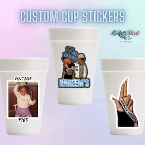 May include: Three white foam cups with custom stickers. One cup has a vintage photo with the year 1985. Another cup features a sticker with two people and the text "Kareem's 22nd Birthday". The third cup has a hand with the text "Cowboy Carter".