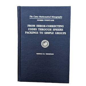May include: A navy blue book with the title "From Error-Correcting Codes Through Sphere Packings to Simple Groups" by Thomas M. Thompson. The book is part of the Carus Mathematical Monographs series, number twenty-one.