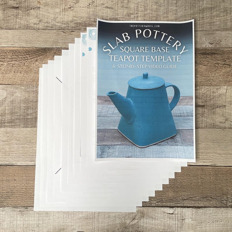May include: A stack of white paper and a printed guide for slab pottery. The guide features a blue square-based teapot with a lid and handle. The text on the guide reads "SLAB POTTERY SQUARE BASE TEAPOT TEMPLATE & STEP-BY-STEP VIDEO GUIDE."