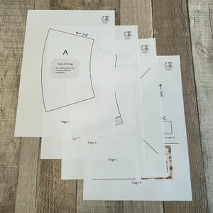 Pode incluir: Um modelo de quatro p&aacute;ginas para fazer um aquecedor de caneca. O modelo inclui instru&ccedil;&otilde;es para cortar ao longo das linhas pretas e ao redor do modelo. O modelo &eacute; etiquetado como "P&aacute;gina 1", "P&aacute;gina 2", "P&aacute;gina 3" e "P&aacute;gina 4".