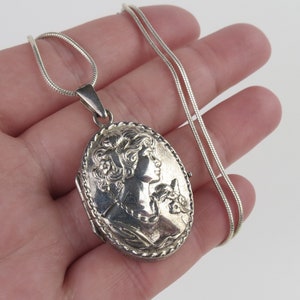 All sterling silver vintage 1960s Italian womans repousse profile oval locket pendant and chain necklace