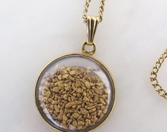 Vintage real gold nuggets flaked cased in a clear pendant set in 12k gold filled on 12k GF chain