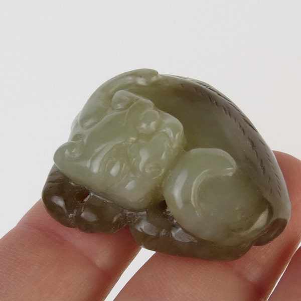 Green and brown hetian nephrite jade carved curled up resting cat pendant