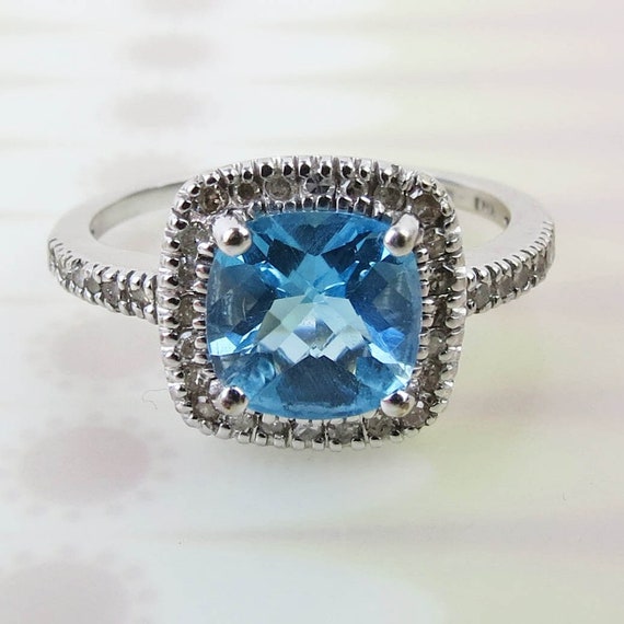 Lite and bright! Fancy cushion cut blue topaz diam