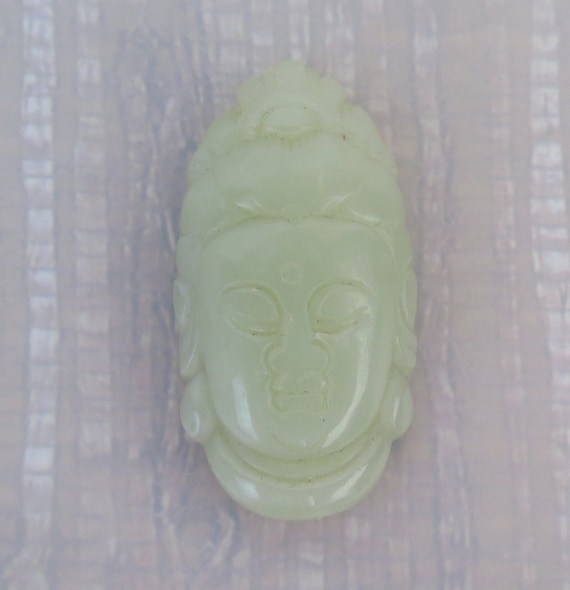 Pale green white Hetian nephrite jade Guanyin head