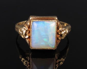 Vintage 10k yellow gold natural 1 carat opal ring with embossed floral flanks size 5.75