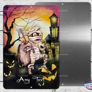 May include: A watercolor illustration of a mummy dressed in white bandages carrying a bag of candy and holding a lollipop. The mummy is walking through a spooky forest with a haunted house in the background. The image has the text "Any Text" at the bottom.