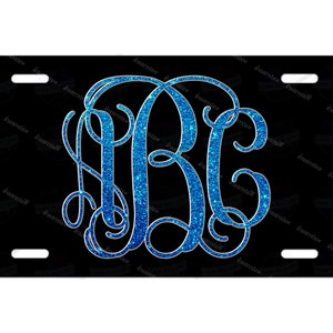 May include: A black license plate with a blue glitter monogram of the letters "ABC".