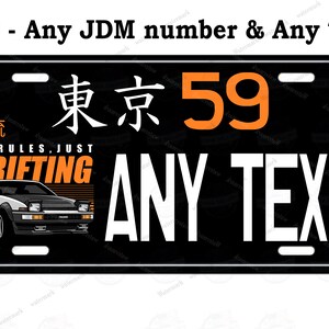 May include: Black and white license plate with the text "Tokyo 59" in orange. The plate also features a white car with the text "No Rules, Just Drifting" in orange. The text "Any Text" is in white.