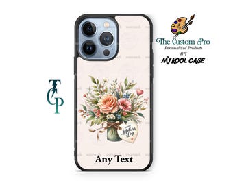 Può includere: Una custodia per telefono con un design floreale e un'etichetta a forma di cuore che dice "Buon giorno della mamma". La custodia è nera e ha un ritaglio per la fotocamera.
