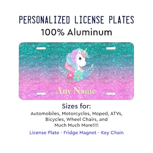 May include: Personalized license plate featuring a unicorn with a rainbow mane and tail, surrounded by flowers, on a pink and blue glitter background. The text "Any Name" is displayed below the unicorn. The plate is made of 100% aluminum.