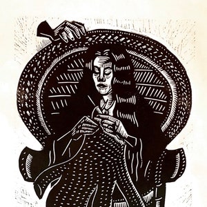 May include: A black and white woodcut print of a person sitting in a chair, knitting. The person is wearing a long coat and has long hair. The chair is ornate and has a high back. The person is sitting in a relaxed pose, with their feet resting on a footstool.