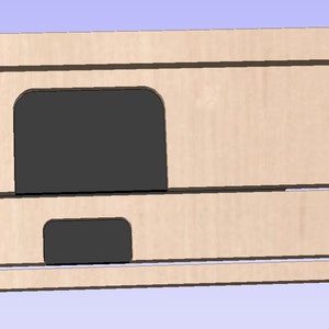 Puede incluir: Una plantilla de madera con recortes para un proyecto. La plantilla tiene un gran recorte ovalado, dos recortes rectangulares y varios recortes circulares m&aacute;s peque&ntilde;os.