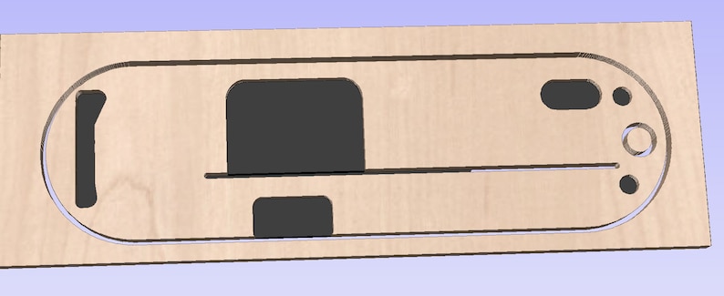 Puede incluir: Una plantilla de madera con recortes para un proyecto. La plantilla tiene un gran recorte ovalado, dos recortes rectangulares y varios recortes circulares m&aacute;s peque&ntilde;os.